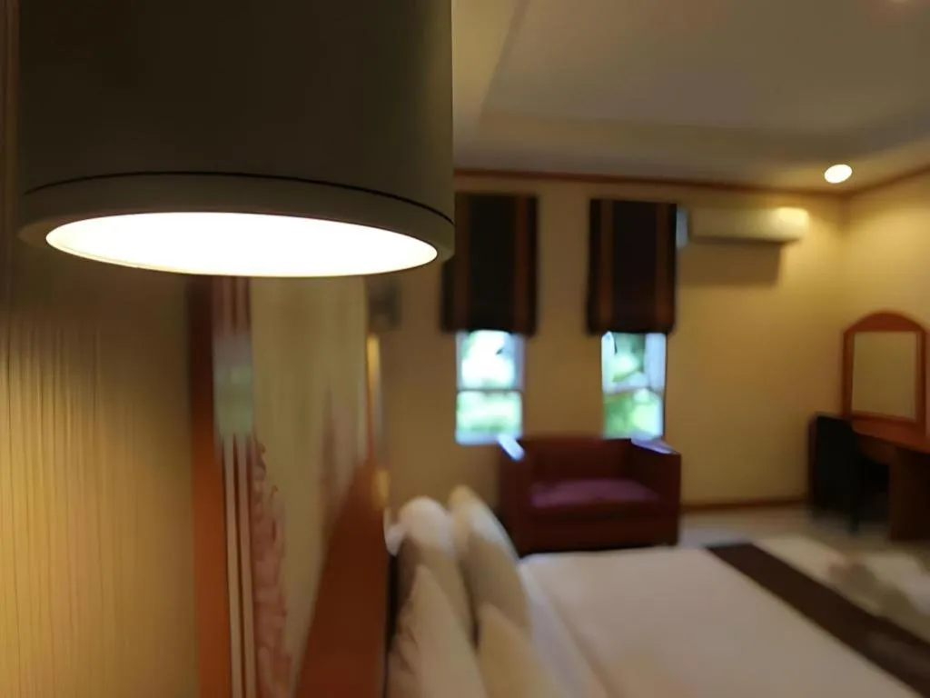 Bed in Thada Chateau Hotel