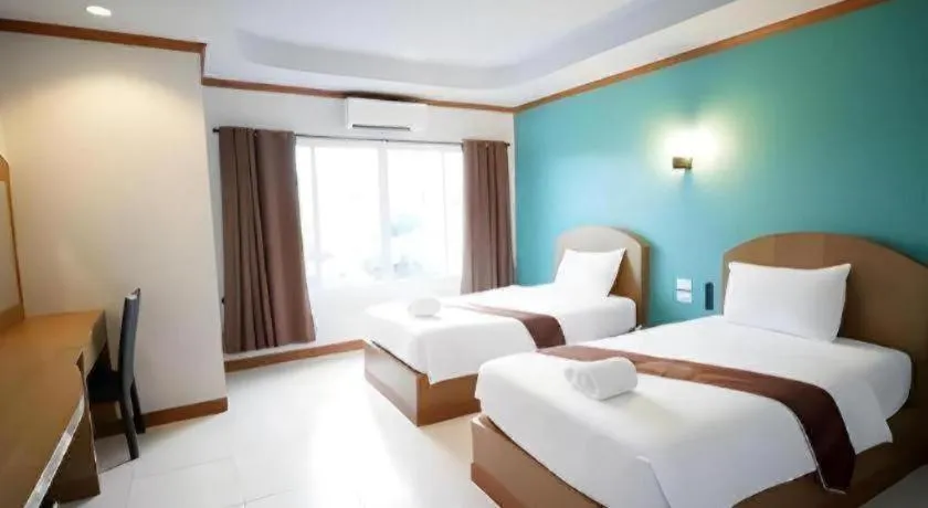 Bed in Thada Chateau Hotel