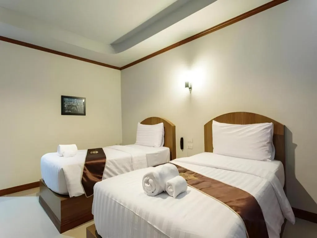 Bed in Thada Chateau Hotel