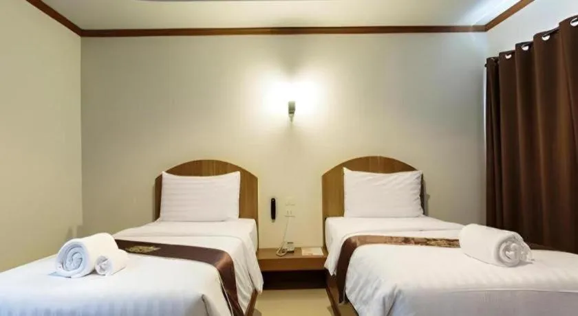 Bed in Thada Chateau Hotel