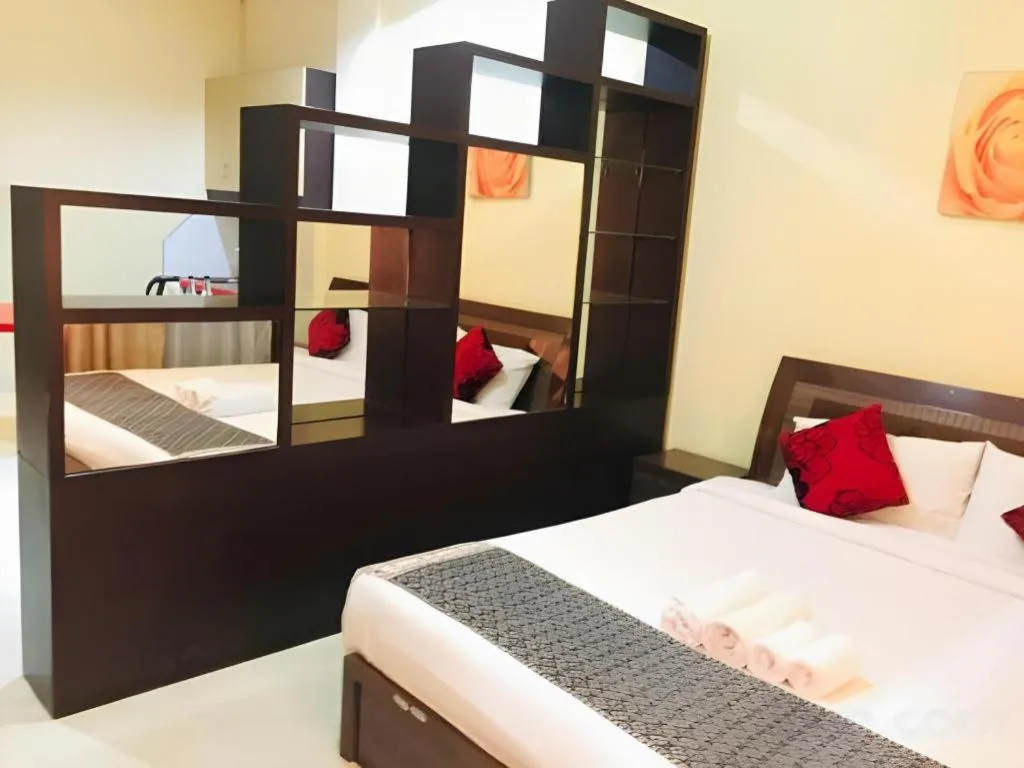 Bed in New Rose Boutique Hotel