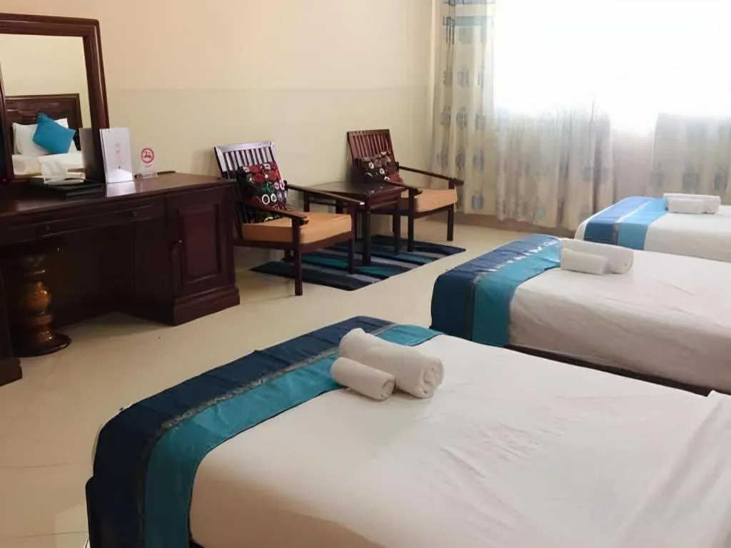 Bed in New Rose Boutique Hotel