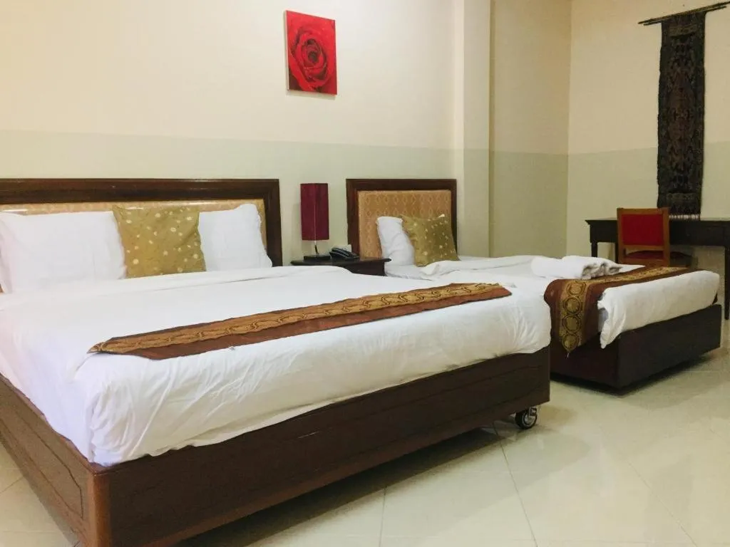 Bed in New Rose Boutique Hotel