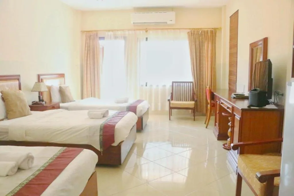 Bed in New Rose Boutique Hotel