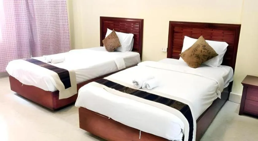 Bed in New Rose Boutique Hotel