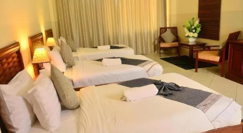 Bed in New Rose Boutique Hotel