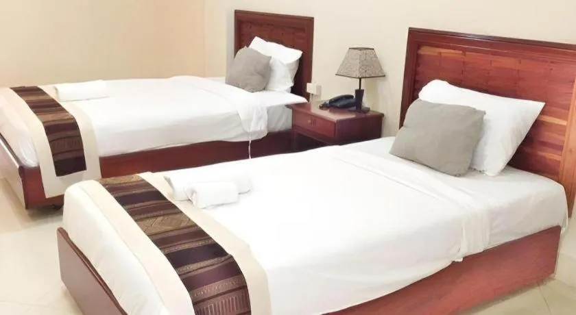 Bed in New Rose Boutique Hotel