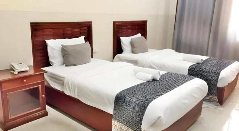 Bed in New Rose Boutique Hotel