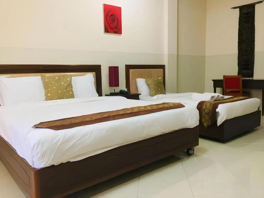 Bed in New Rose Boutique Hotel