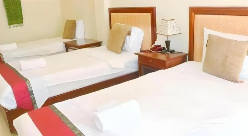 Bed in New Rose Boutique Hotel