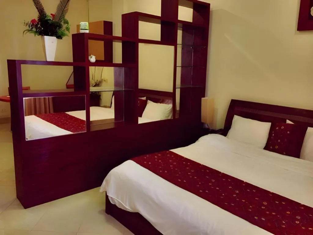 Bed in New Rose Boutique Hotel