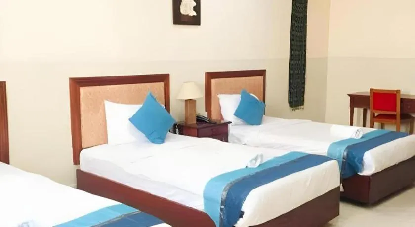 Bed in New Rose Boutique Hotel