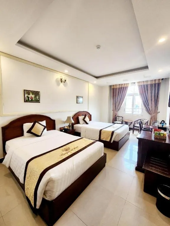 Bed in Marguerite Hotel