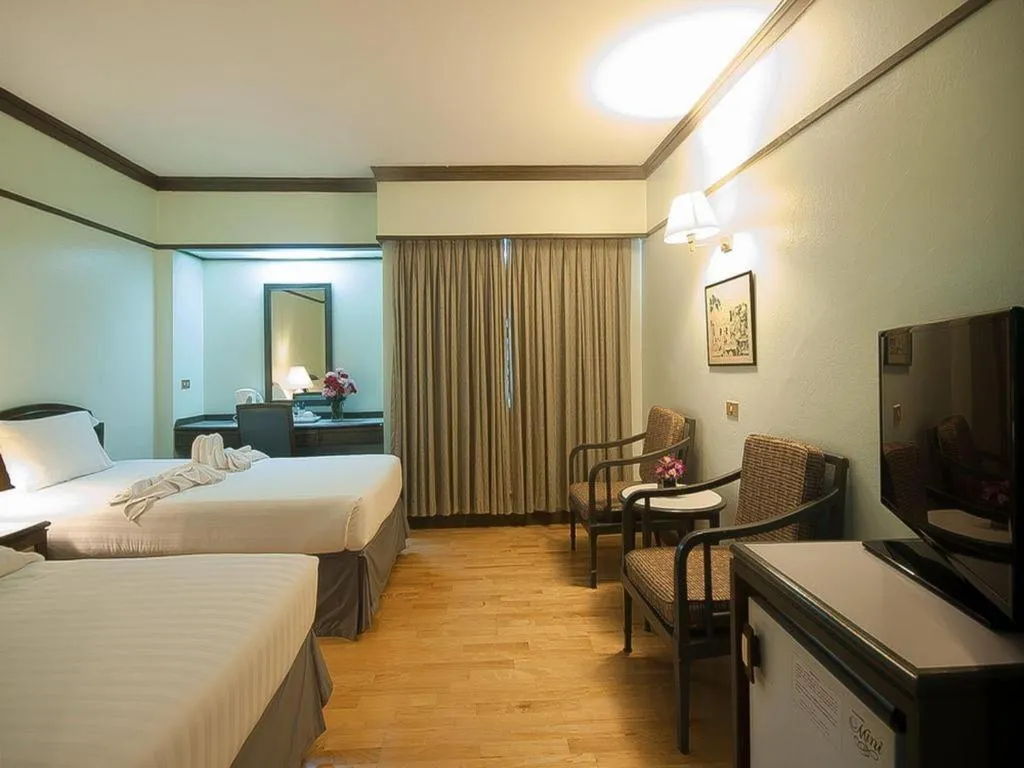 Bed in Grand Plaza Hotel