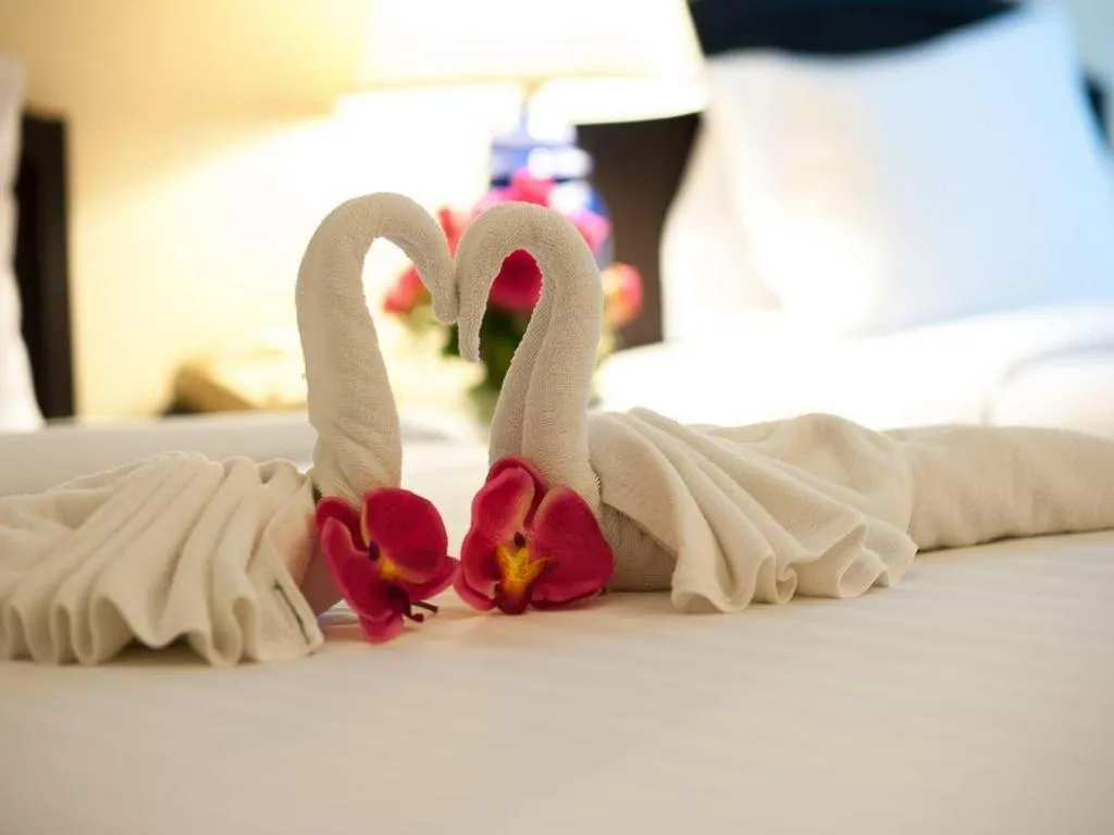 Bed in Grand Plaza Hotel