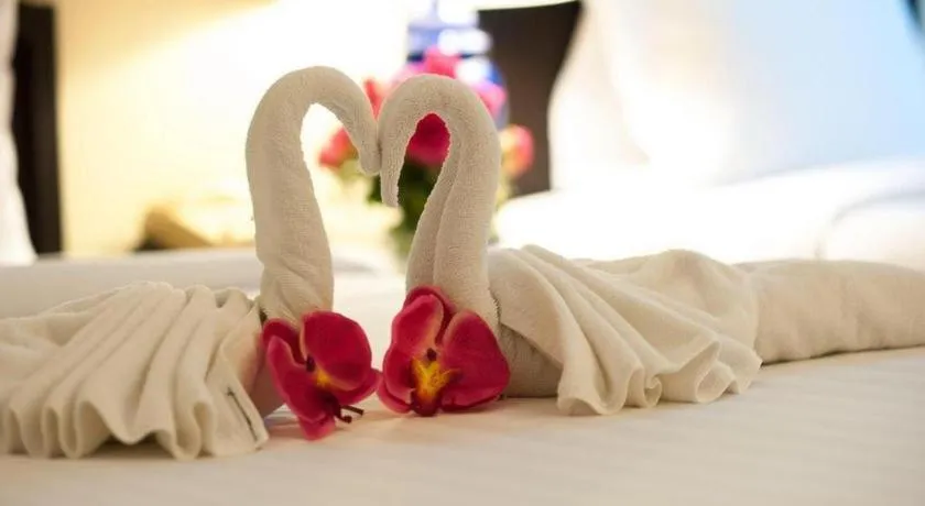 Bed in Grand Plaza Hotel