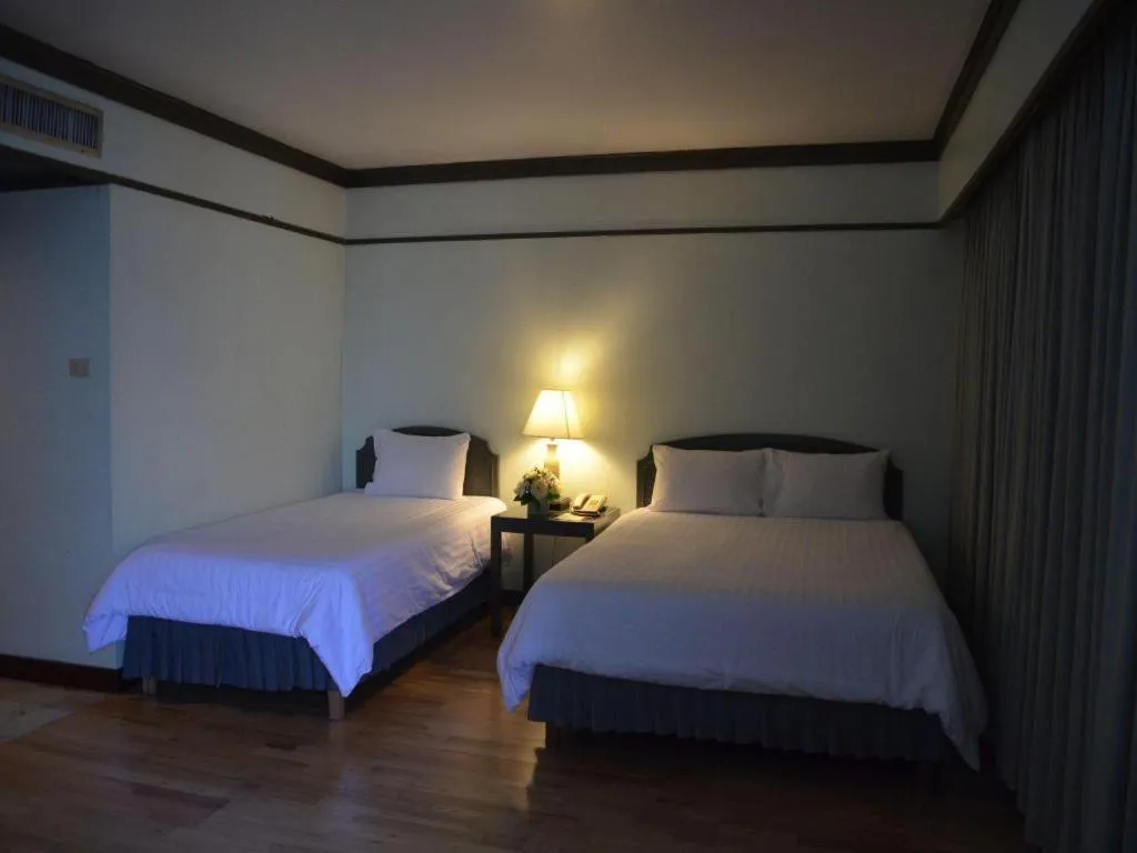 Bed in Grand Plaza Hotel