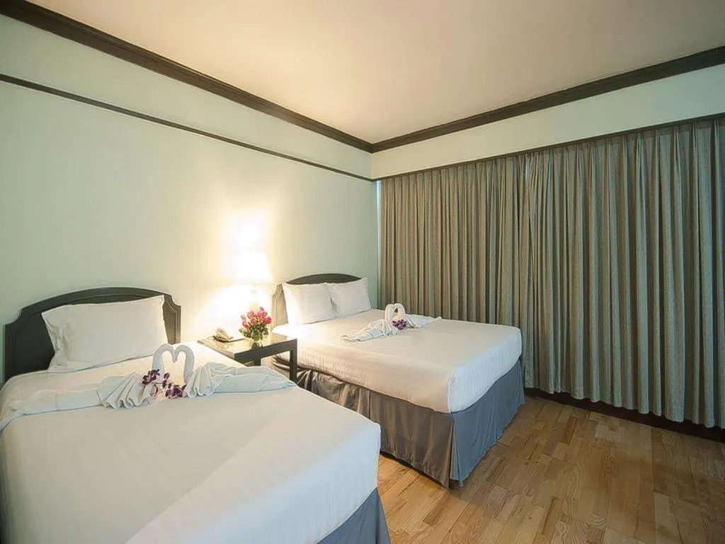 Bed in Grand Plaza Hotel