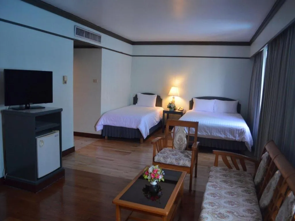 Bed in Grand Plaza Hotel