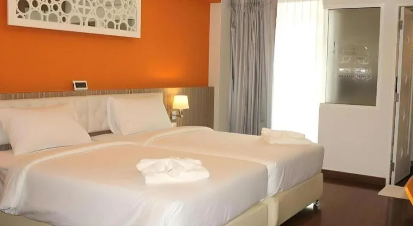 Bed in Chariot Pattaya Hotel