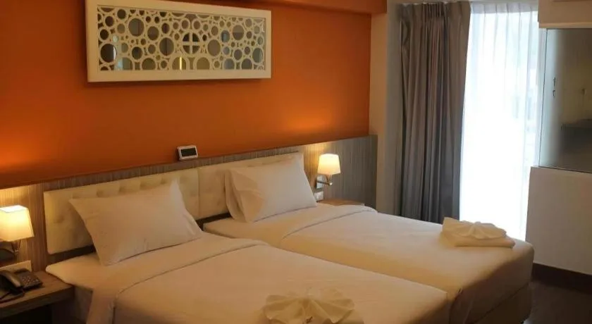 Bed in Chariot Pattaya Hotel