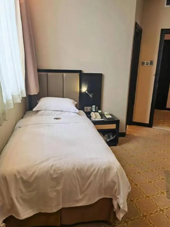 Bed in Nanning Yongjiang Hotel