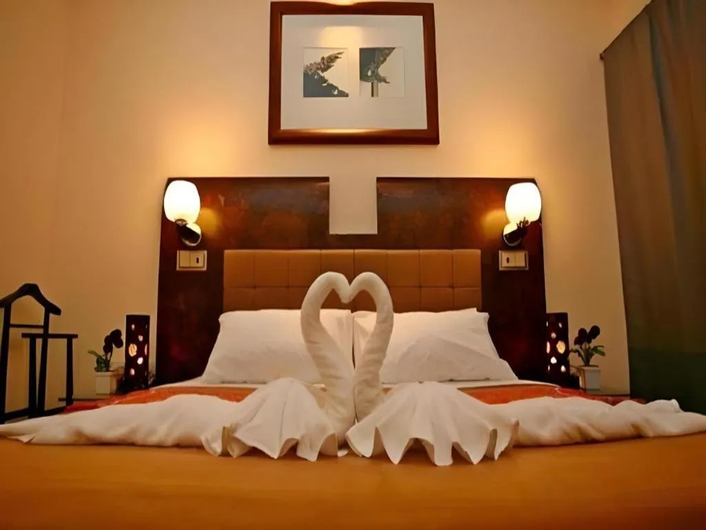 Bed in Lotusland Resort