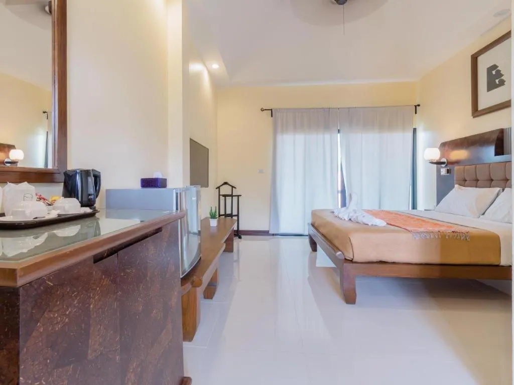 Bed in Lotusland Resort