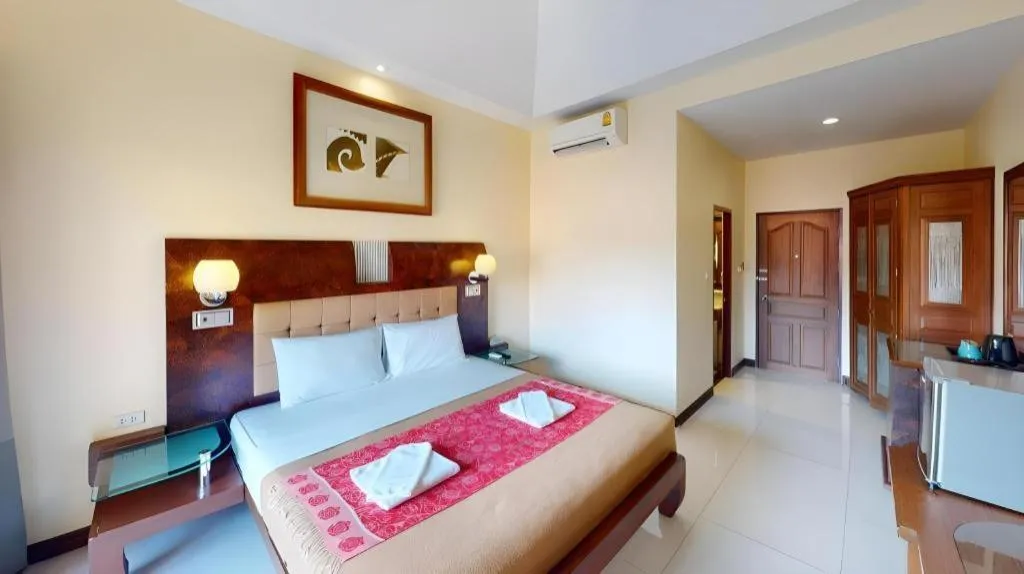 Bed in Lotusland Resort