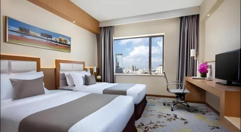 Bed in Kunming Jinjiang Hotel