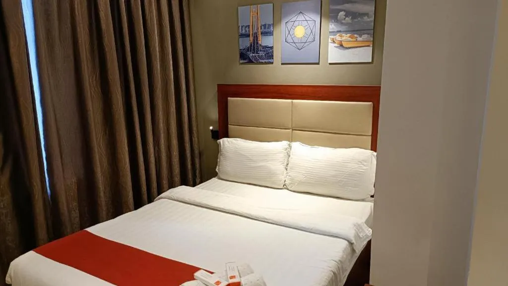 Bed in Cherry Midtown Hotel