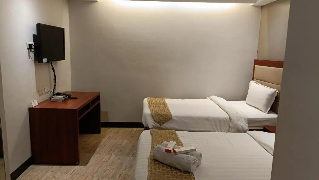 Bed in Cherry Midtown Hotel