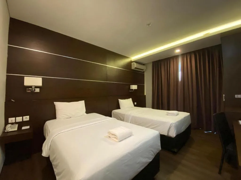 Bed in D'Season Premiere Hotel