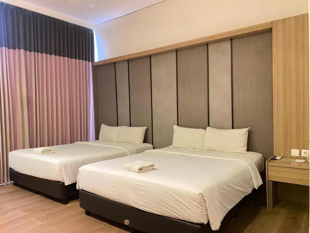 Bed in D'Season Premiere Hotel