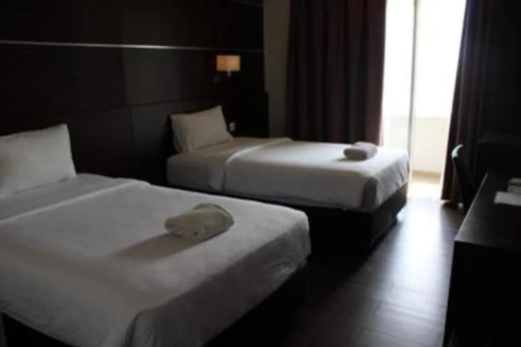 Bed in D'Season Premiere Hotel