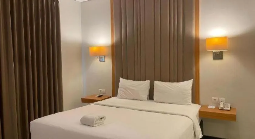 Bed in D'Season Premiere Hotel