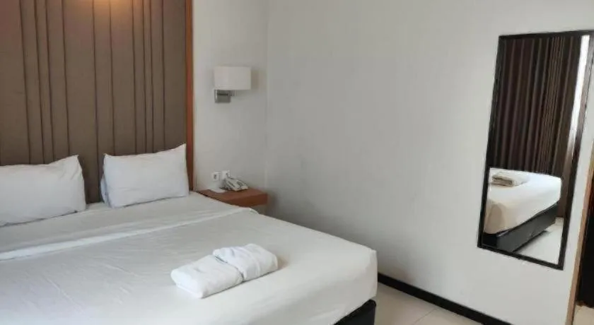 Bed in D'Season Premiere Hotel