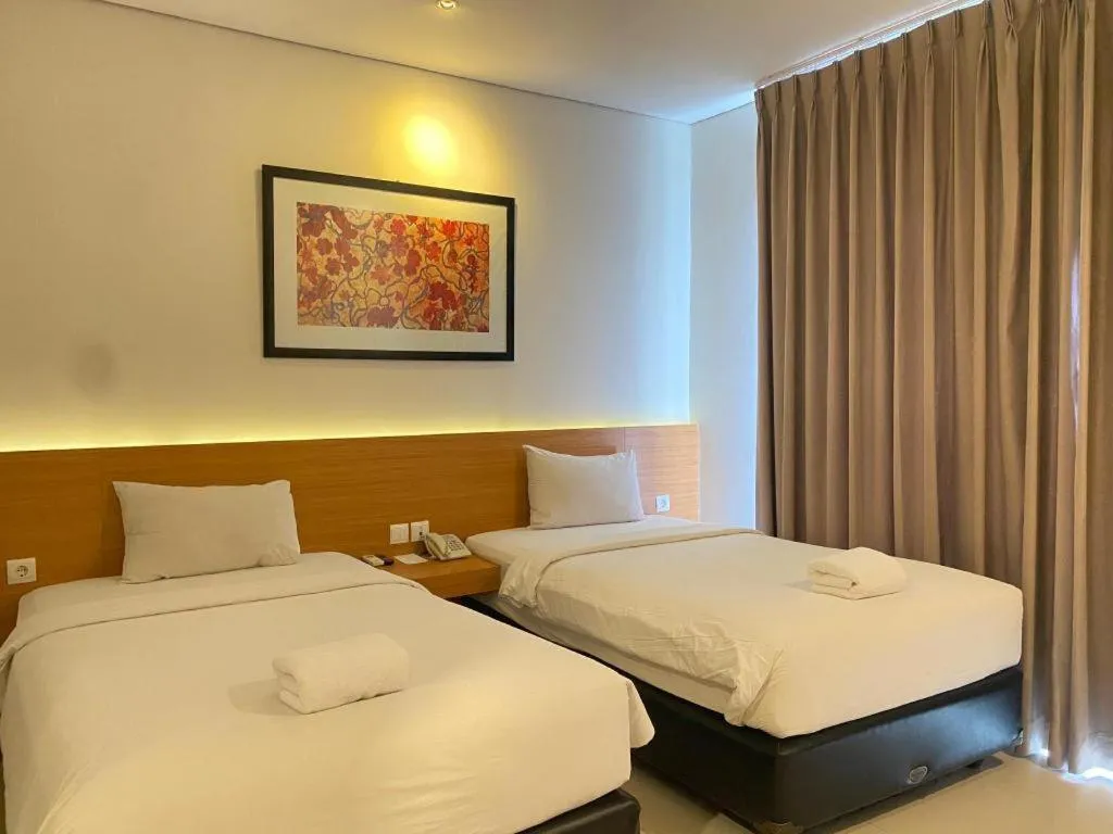 Bed in D'Season Premiere Hotel