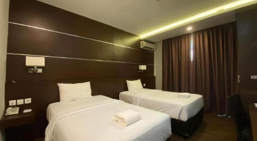 Bed in D'Season Premiere Hotel