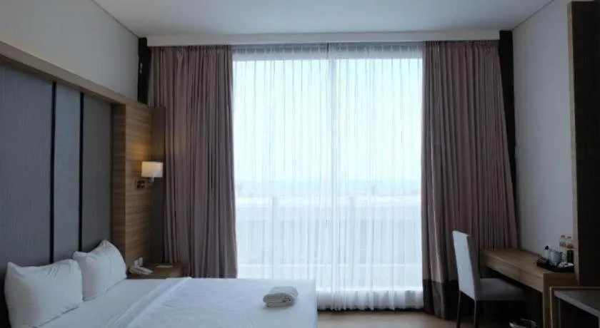 Bed in D'Season Premiere Hotel