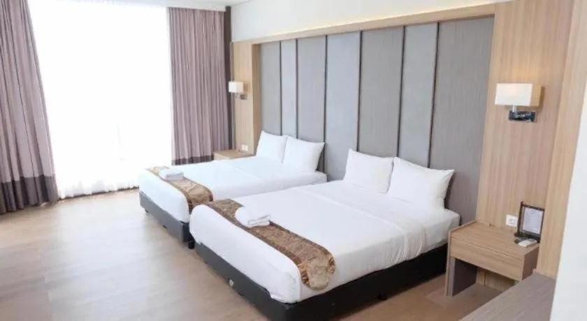 Bed in D'Season Premiere Hotel