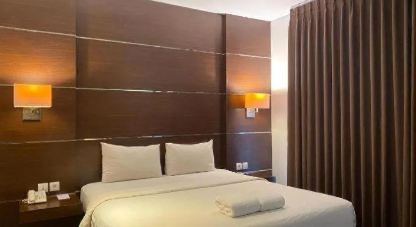 Bed in D'Season Premiere Hotel