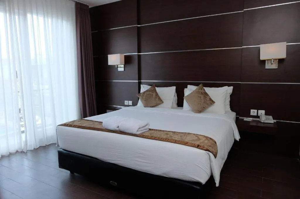 Bed in D'Season Premiere Hotel