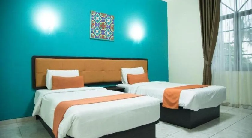 Bed in Ole Suite Hotel