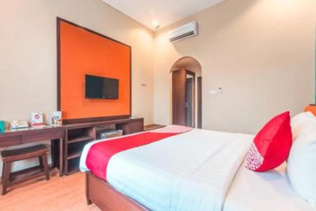 Bed in Ole Suite Hotel