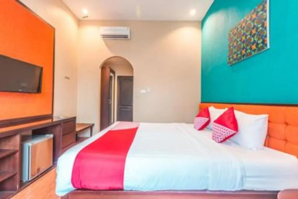 Bed in Ole Suite Hotel