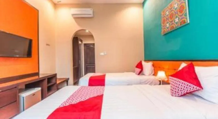 Bed in Ole Suite Hotel