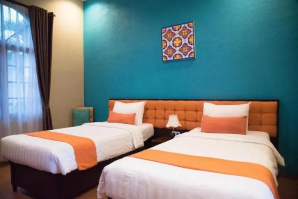 Bed in Ole Suite Hotel