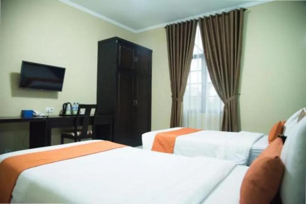 Bed in Ole Suite Hotel