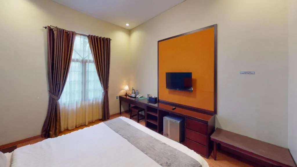 Bed in Ole Suite Hotel